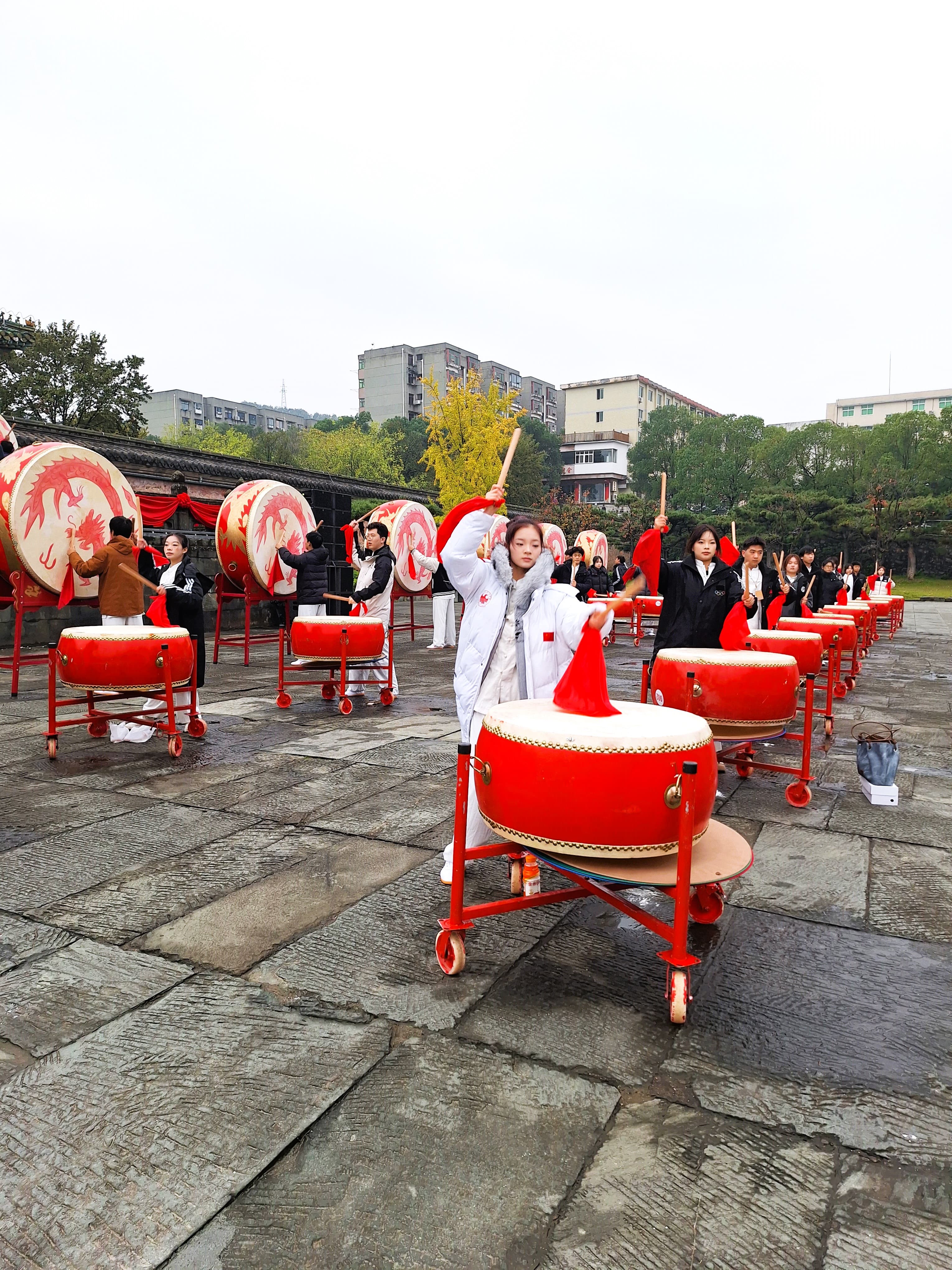 Youth performers striking drums at Yuxu Palace during the Wudang Tai Chi Culture Festival.
