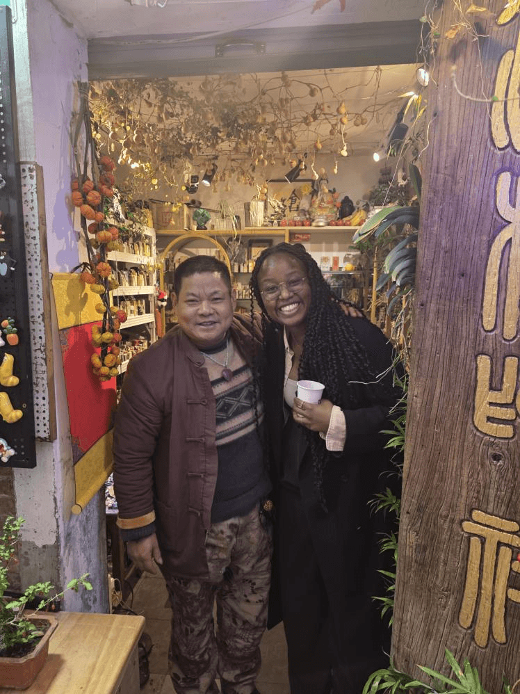 Nala Meite with a craftsman at Tianzifang Market in Shanghai.
