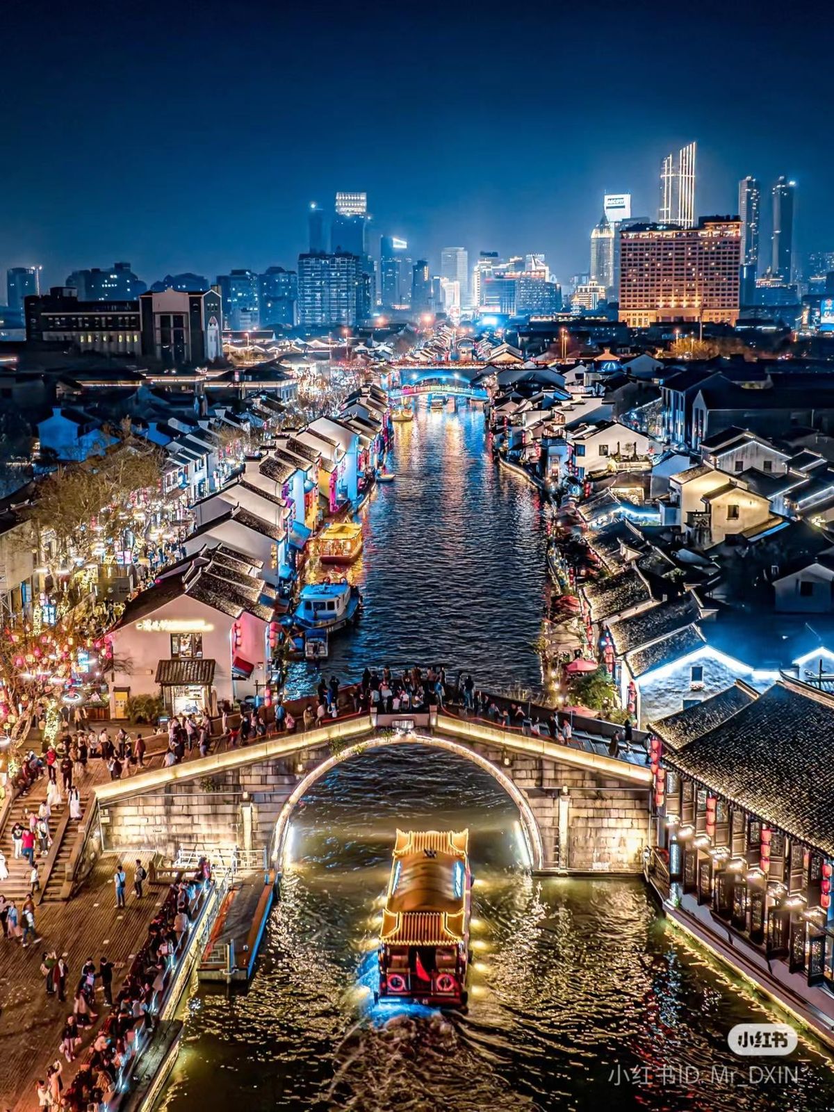 Suzhou canal waterfront at night.